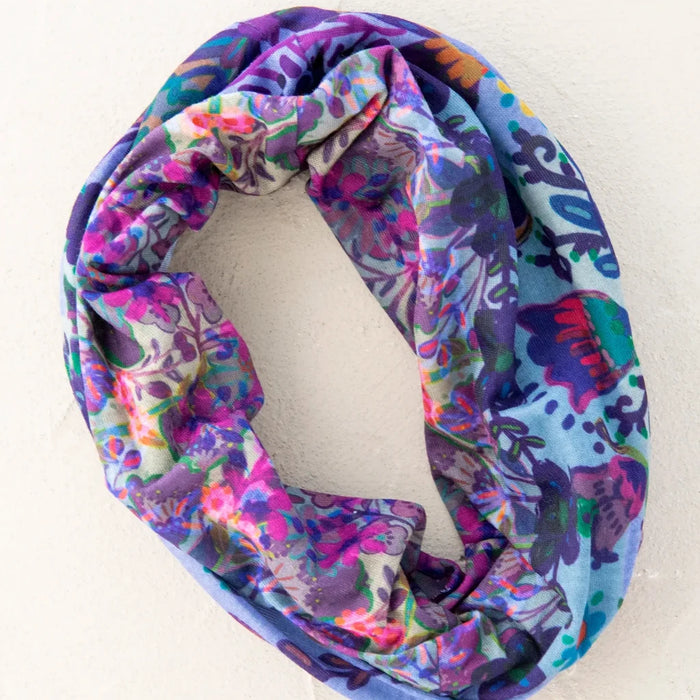 A vibrant boho bandana crafted from assorted colorful fabrics, displaying a unique blend of patterns and textures.