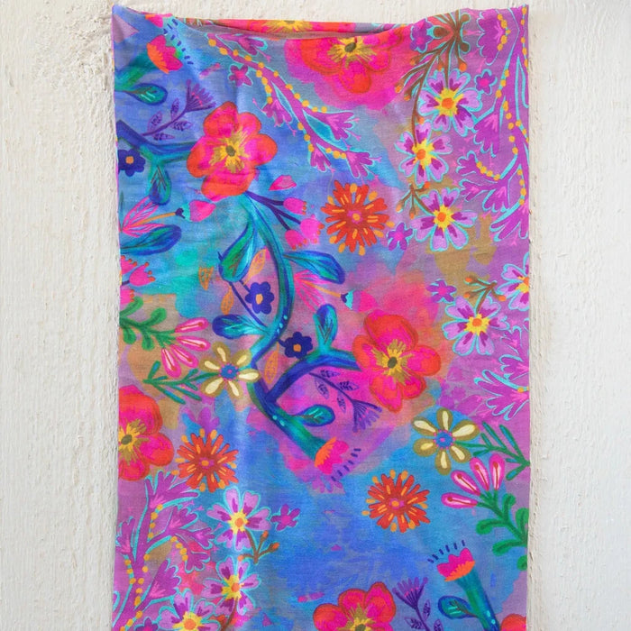 A colorful scarf adorned with a delicate flower pattern.