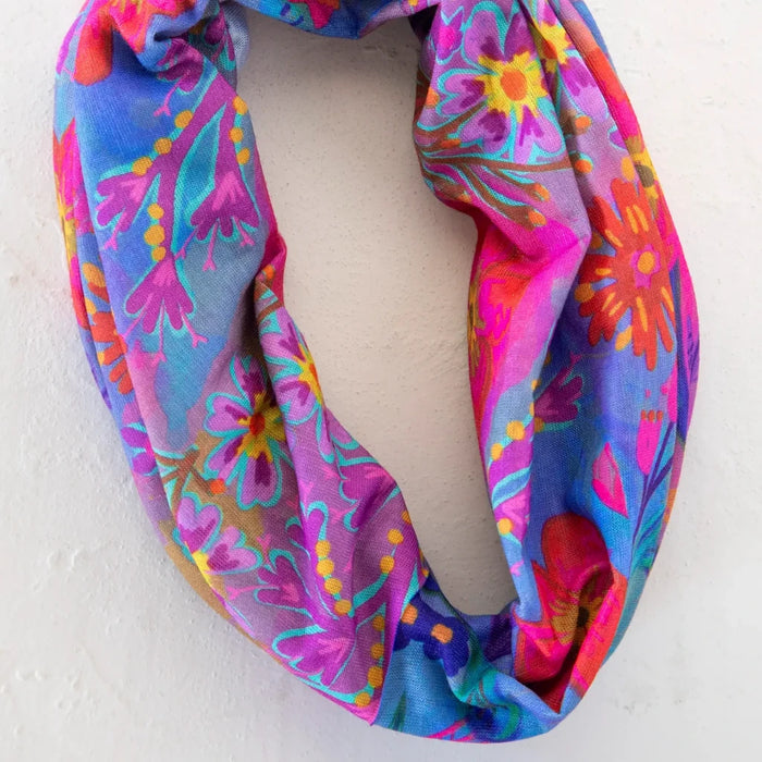 A bright scarf showcasing a lively flower design throughout.