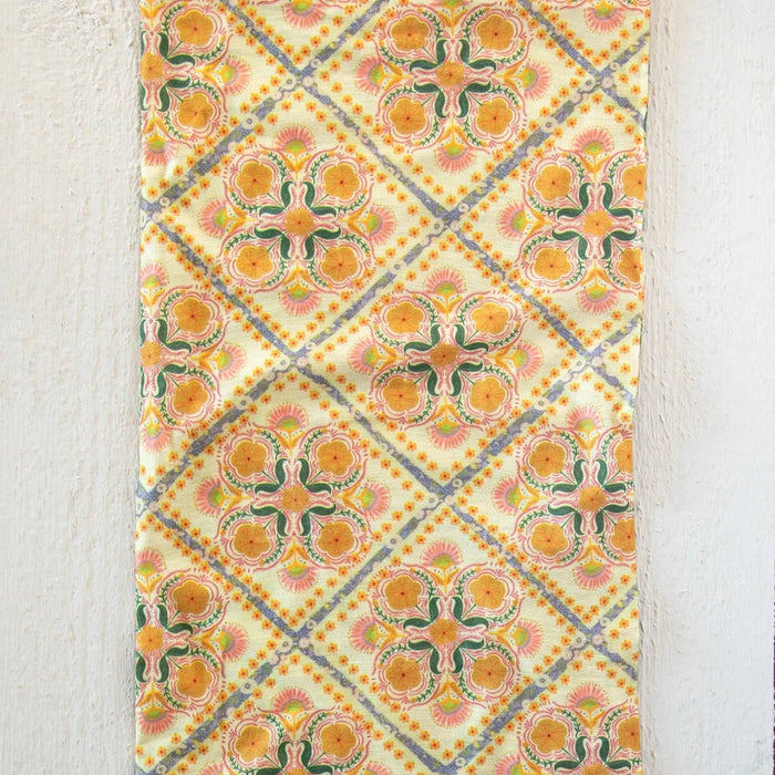 A vibrant yellow bandana with a boho style, showcasing a natural life theme, ideal for fashion or outdoor activities.