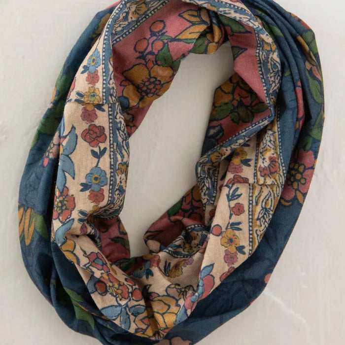 A boho bandana featuring a blue and white fabric pattern, ideal for adding a stylish touch to any outfit.
