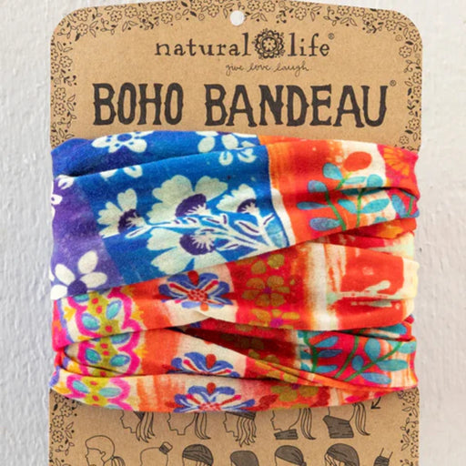 The boho bandeau features a lively, colorful fabric with an eclectic mix of patterns and shades.