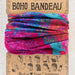 Pink boho bandana with intricate patterns, perfect for adding a stylish touch to any outfit.