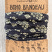 Boho bandana featuring a black and white floral print, showcasing a stylish and trendy design.