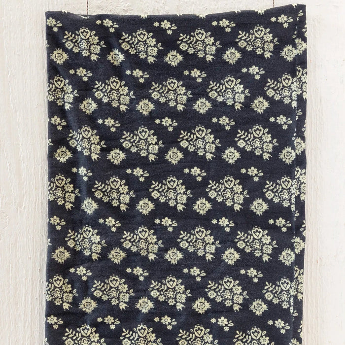 A black and white floral print bandana in a boho style, perfect for adding flair to any outfit.