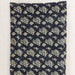 A black and white floral print bandana in a boho style, perfect for adding flair to any outfit.