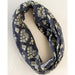 Bohemian-style bandana with a striking black and white floral pattern, ideal for fashion-forward looks.