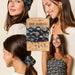 Stylish boho bandana crafted from a black and white floral fabric, enhancing any casual ensemble.
