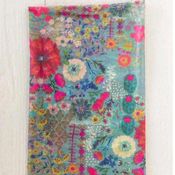 The boho bandeau features a lively, colorful fabric with intricate designs and patterns.