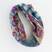 Natural Life Boho Bandeau headband featuring a colorful gingham floral patchwork design.