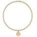 Crafted with a strand of polished gold-tone beads, this bracelet offers a timeless and elegant look