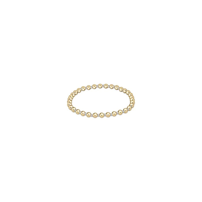 "Hand beaded on high performance elastic for a slight stretch to easily roll on and off your wrist"