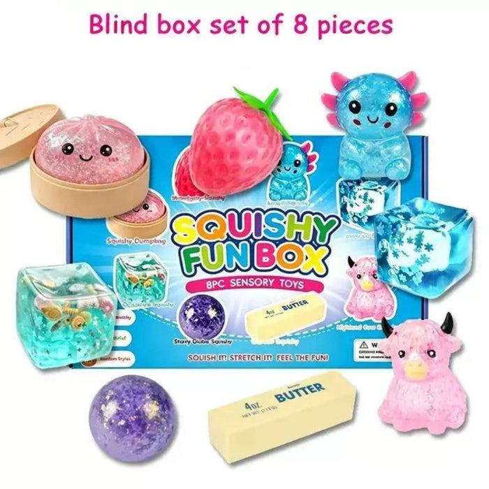 Think Sweet Squishy Fun Box Deluxe with eight toys: dumpling, strawberry, axolotl, two cubes, glitter ball, butter, and cow.