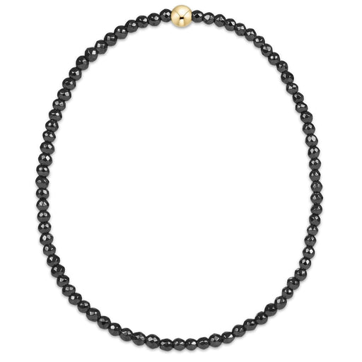 enewton design faceted hematite bead bracelet with single gold accent bead.
