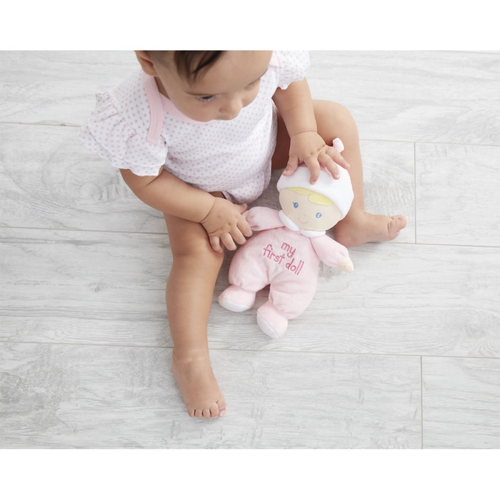 baby with the doll on the floor