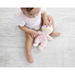 baby with the doll on the floor