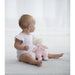 side view of baby with the doll