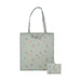 A green tote bag decorated with vibrant birds and floral patterns.