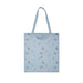 A blue tote bag featuring a playful cat design on the front.
