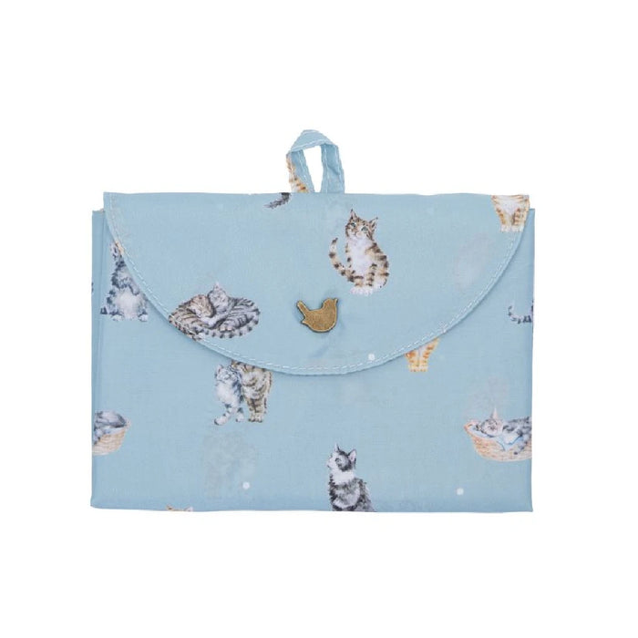 A blue tote bag adorned with an illustration of a cat.
