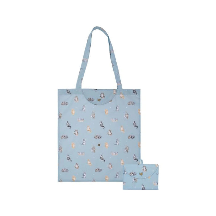 A blue tote bag showcasing a cat graphic prominently displayed.