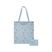 A blue tote bag showcasing a cat graphic prominently displayed.