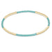 "Hand beaded on high performance elastic for a slight stretch to easily roll on and off your wrist"