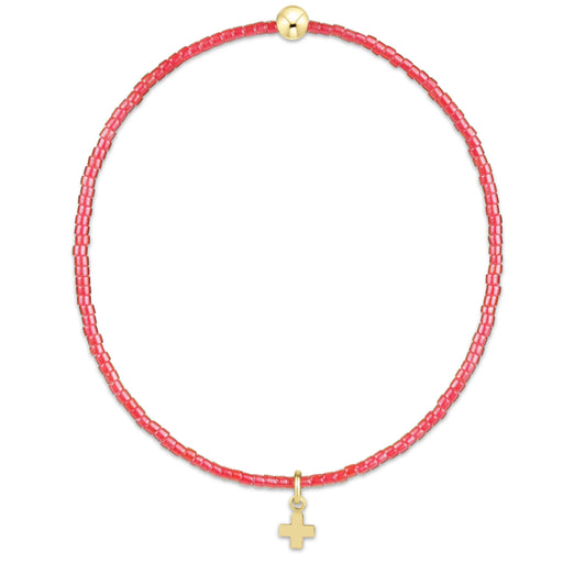 "Designed with soft pink seed beads and accented by a polished gold bead, this bracelet offers a meaningful yet fashionable look."