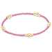 Featuring a harmonious blend of soft seed beads and polished gold-tone accent beads.
