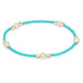 "Featuring soft pastel seed beads, luminous pearl accents, and polished gold-tone spacer beads."