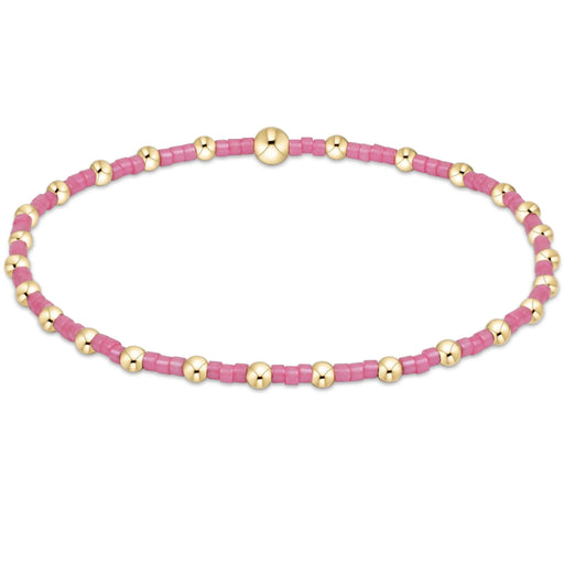 Featuring vibrant pink seed beads accented with polished gold-tone beads