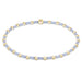 "Featuring vibrant pink seed beads accented with polished gold-tone beads, this bracelet offers the perfect blend of fun and elegance"