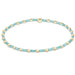 "Hand beaded on high performance elastic for a slight stretch to easily roll on and off your wrist"