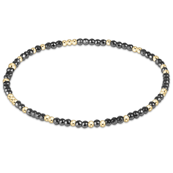 enewton design Hope Unwritten bracelet with faceted hematite beads and gold-filled accent beads.