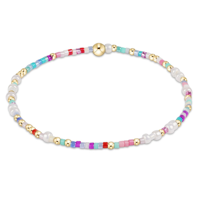"Made with various colors of randomly mixed 2mm seed beads and 2mm 14k gold-filled beads"
