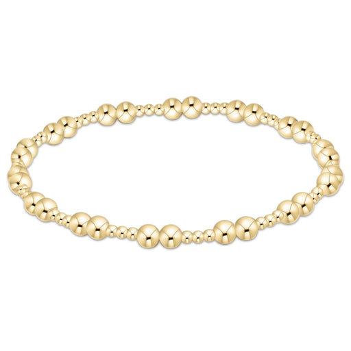 Gold‑filled beaded bracelet with 2mm and 4mm beads on elastic, available in two sizes