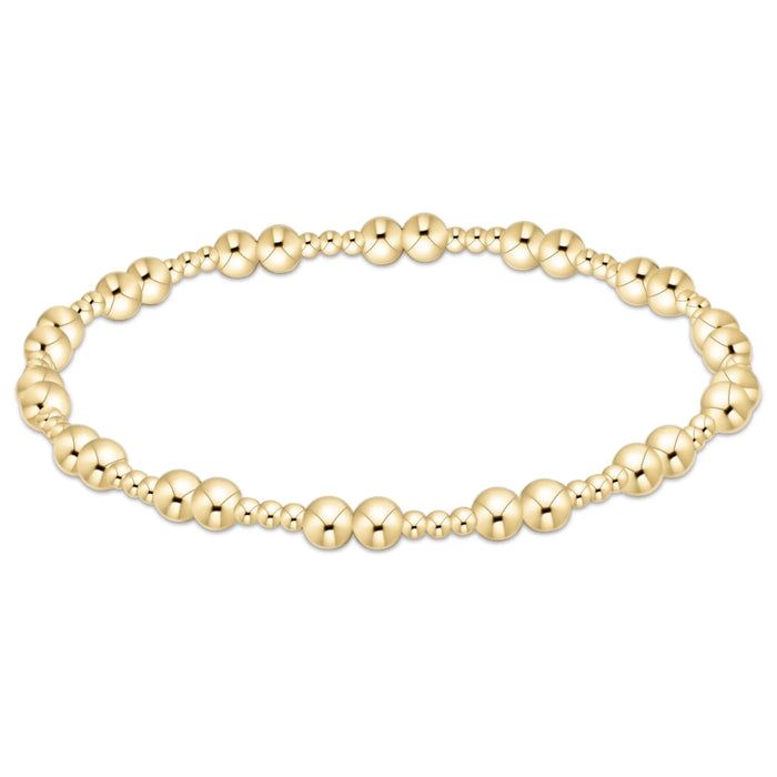 Gold‑filled beaded bracelet with 2mm and 4mm beads on elastic, available in two sizes