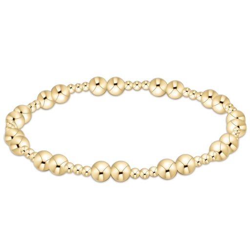 Gold‑filled beaded bracelet with 2.5mm and 5mm beads on elastic, available in standard and extended sizes.