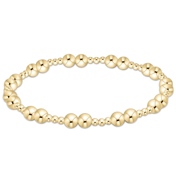 Gold‑filled beaded bracelet with 2.5mm and 5mm beads on elastic, available in standard and extended sizes.