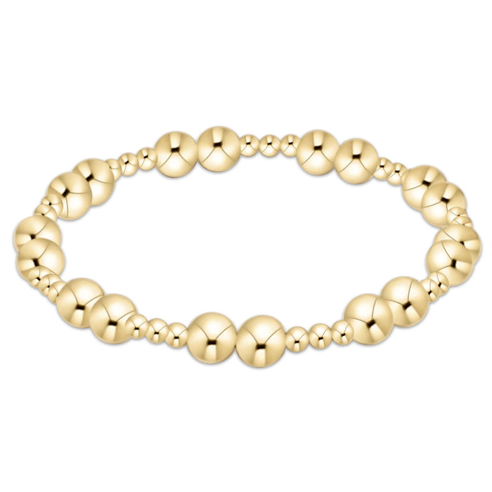 Gold‑filled beaded bracelet with 3mm and 6mm beads on elastic, available in standard and extended sizes.