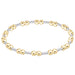 Two-tone gold and silver beaded bracelet on a white background