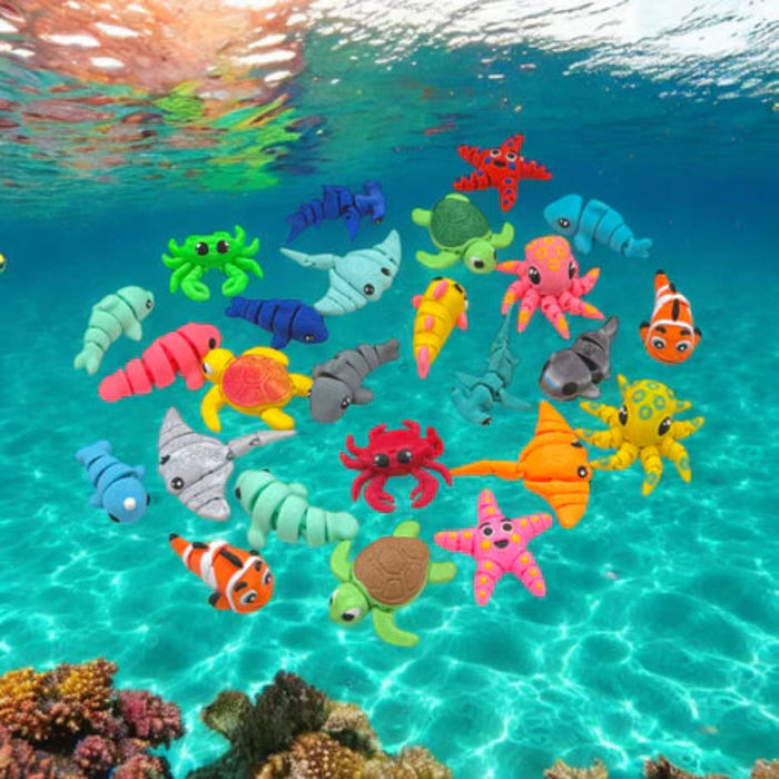 Colorful toy marine  wiggletz animals floating in clear blue water with coral.