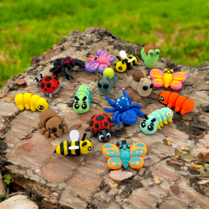 Colorful  mini toy insects on a wooden log with a natural background
