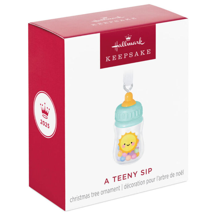 Hallmark Keepsake Christmas ornament packaging with a baby bottle design.