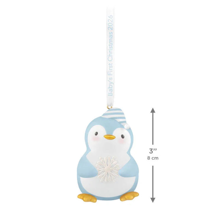 Penguin ornament with baby's first Christmas 2023 text on a white background