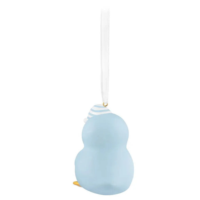 Blue ceramic penguin ornament on a white background