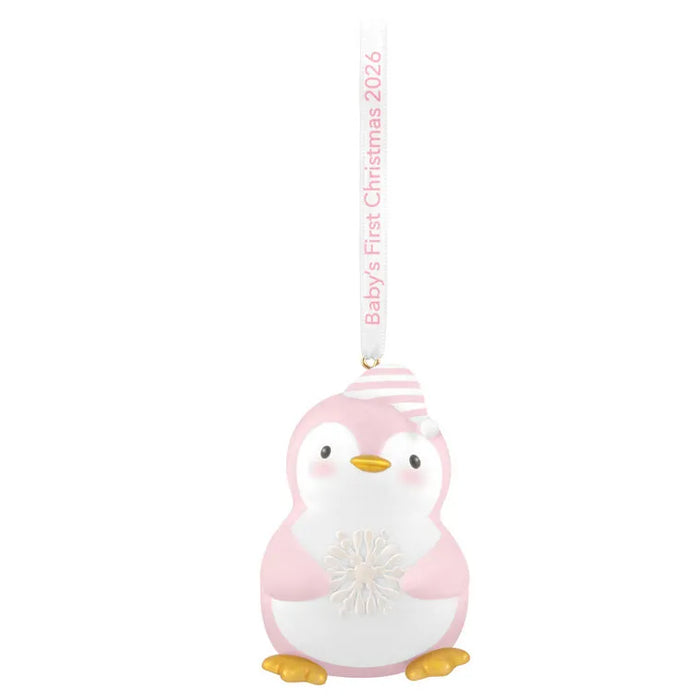 Front view of pink and white penguin ornament with striped cap and textured snowflake