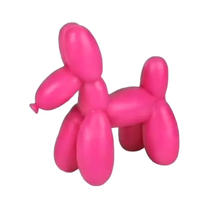 Pink balloon dog sculpture on a white background