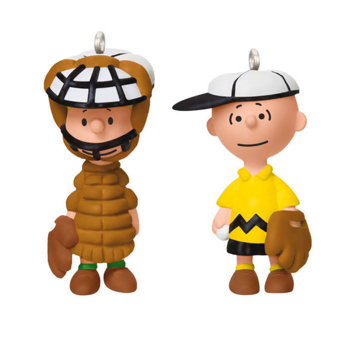 Two Mini ornaments of the Peanuts Gang, Charlie Brown as a baseball player and a Linus as the  catcher  on a white background 
