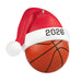 Close-up glossy orange basketball ornament with pebbled texture and red Santa hat featuring 2026 text